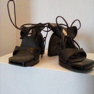 Black patent leather abstract heel lace up pumps. Size 7. Never worn.